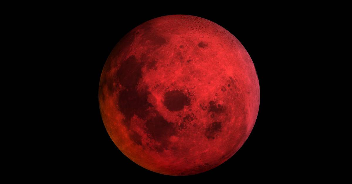 blood red moon on black background