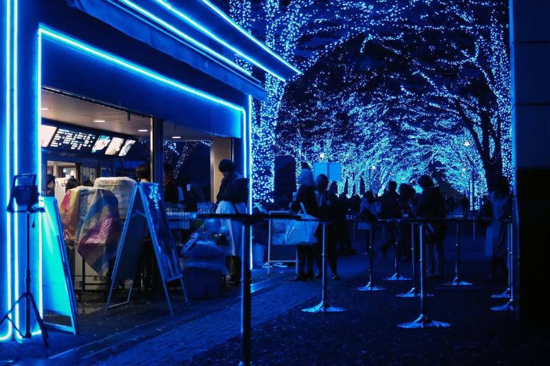 blue lights on trees outdoors at restaurant
