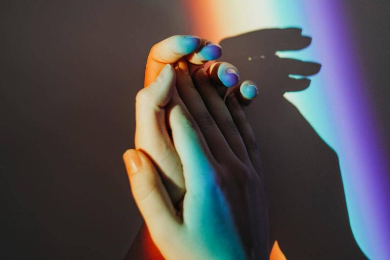 persons-hands-with-rainbow-colors