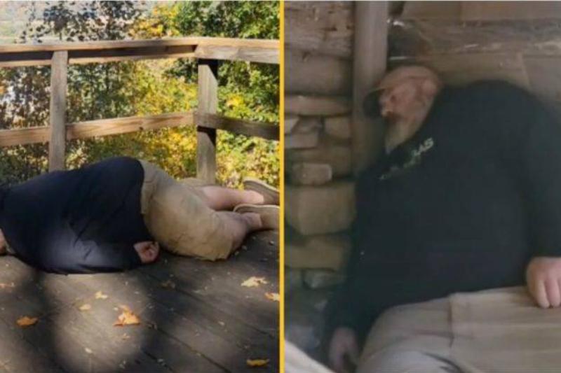 man plays dead on wooden surfaces