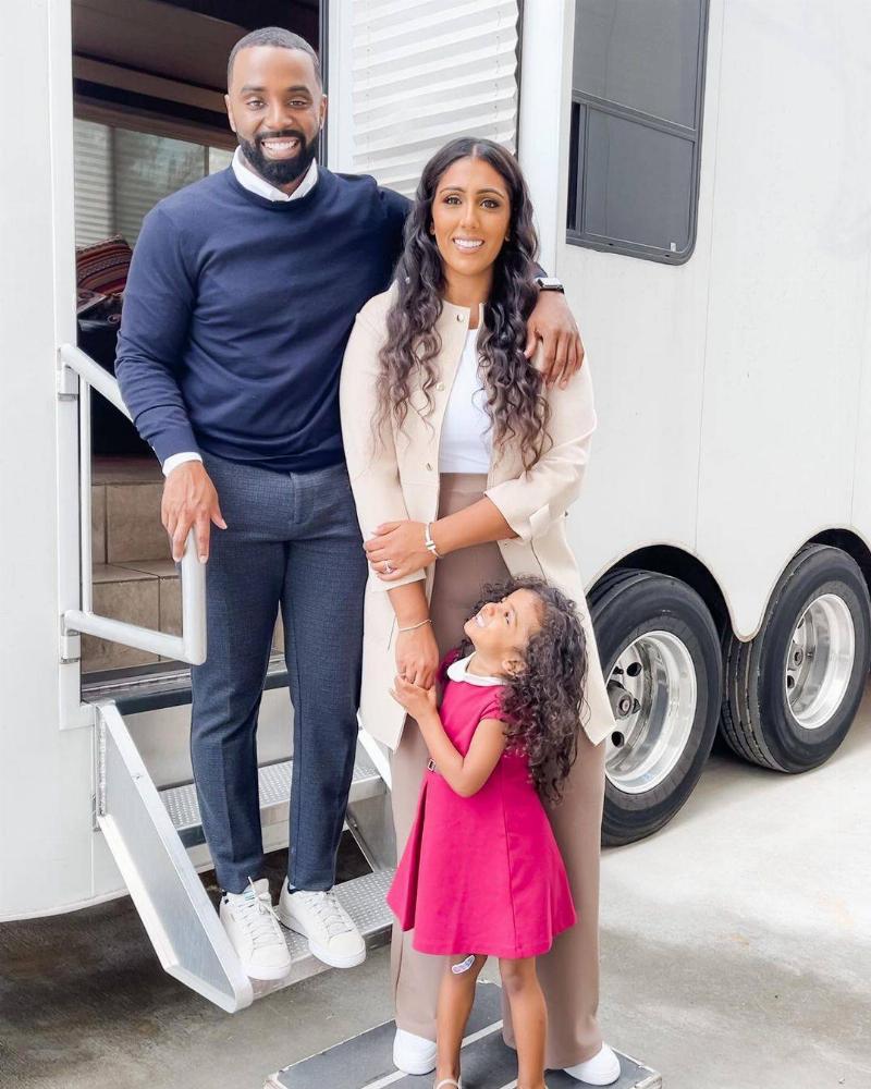 family photo of little girl with her parents at truck