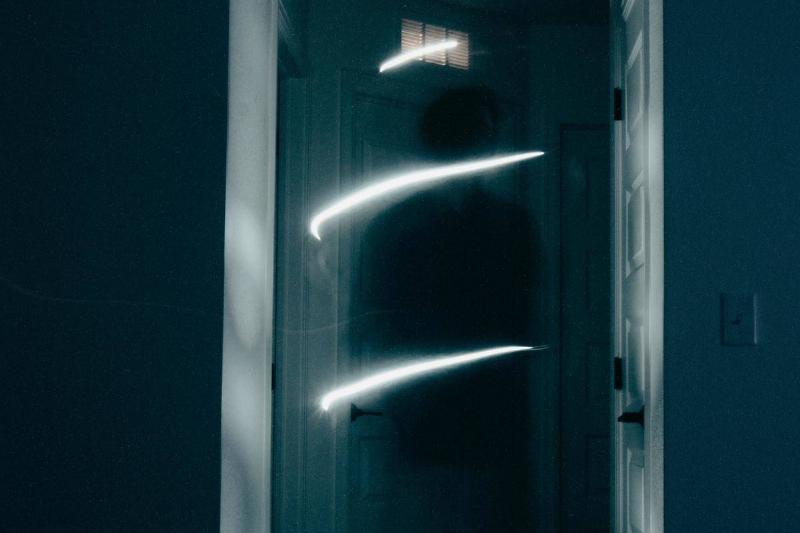 view-of-dark-hallway with ghost in the way