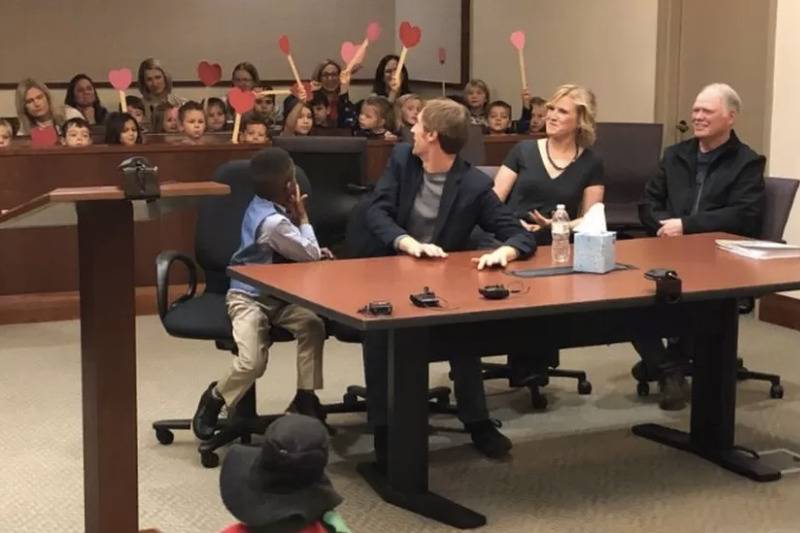 His friends held up love hearts inside the court