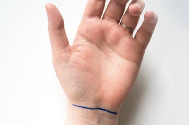 one line on wrist in blue marker