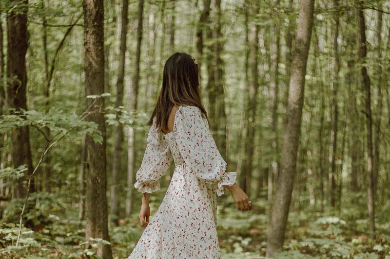 stylish-woman-strolling-in-green-forest