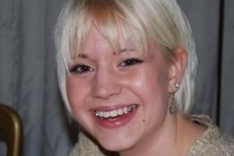 Toni when she was younger smiles with blond hair