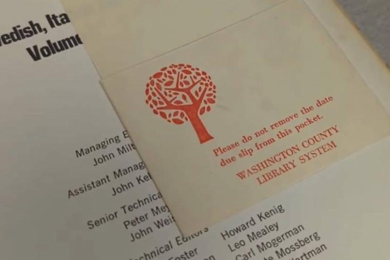A screenshot from the library's video of the book, showing the library tag on the inside.