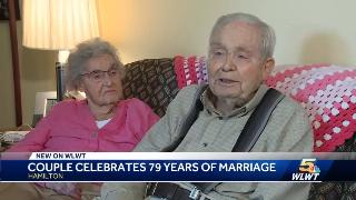 June and Hubert sitting next to one another while being filmed for WLWT.