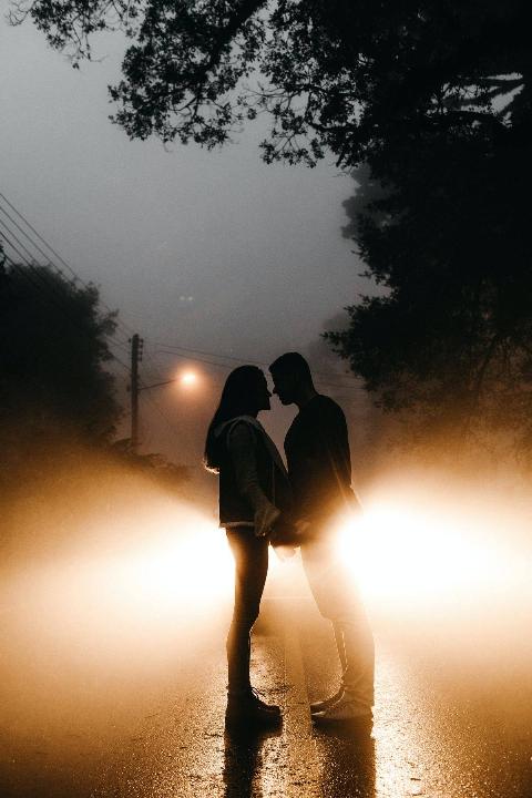 photo-of-couple-standing-on-road
