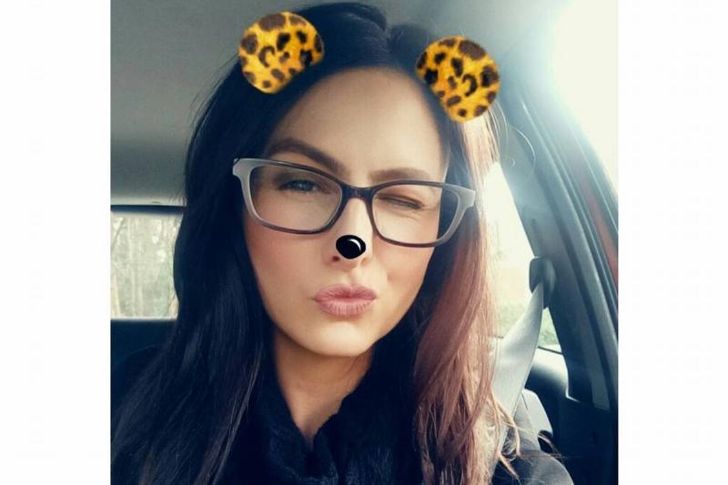A selfie of Lauren in a snapchat filter and glasses.