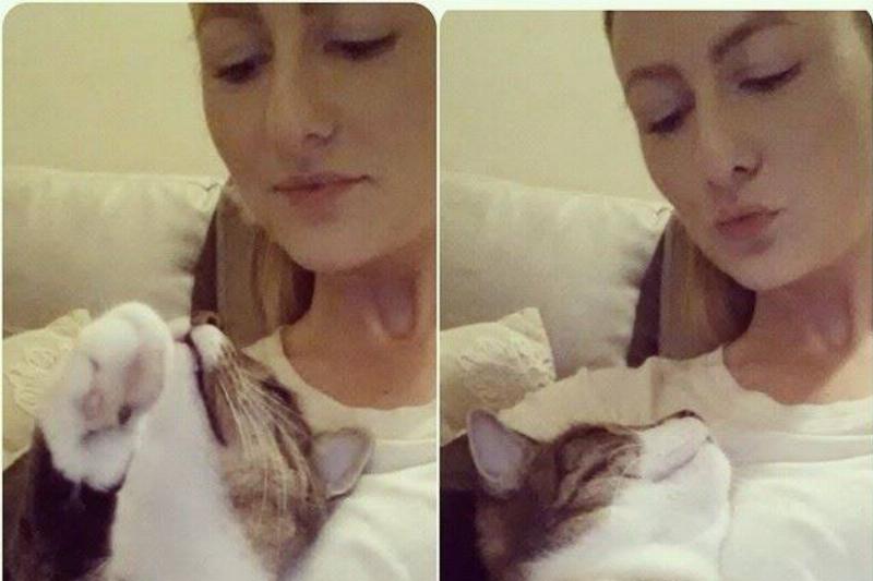 Two selfies of Lauren with her cat.