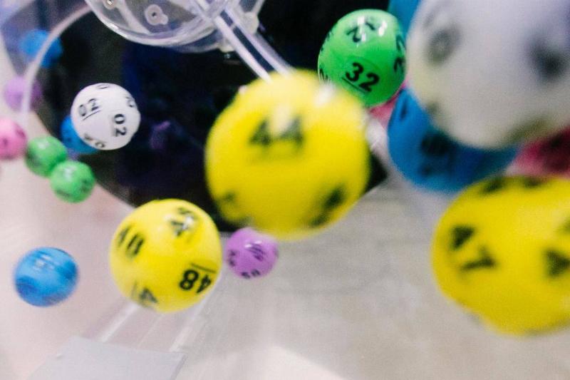 Lottery powerball balls spinning in a plastic container