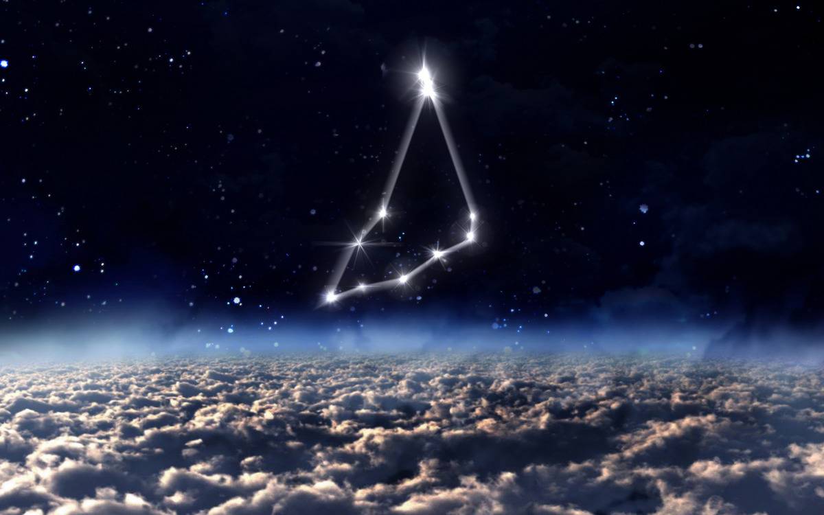 A digital rendition of the Capricorn constellation in the night sky above clouds.
