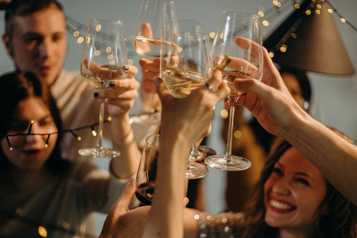 People cheers-ing glasses of champagne at New Years.