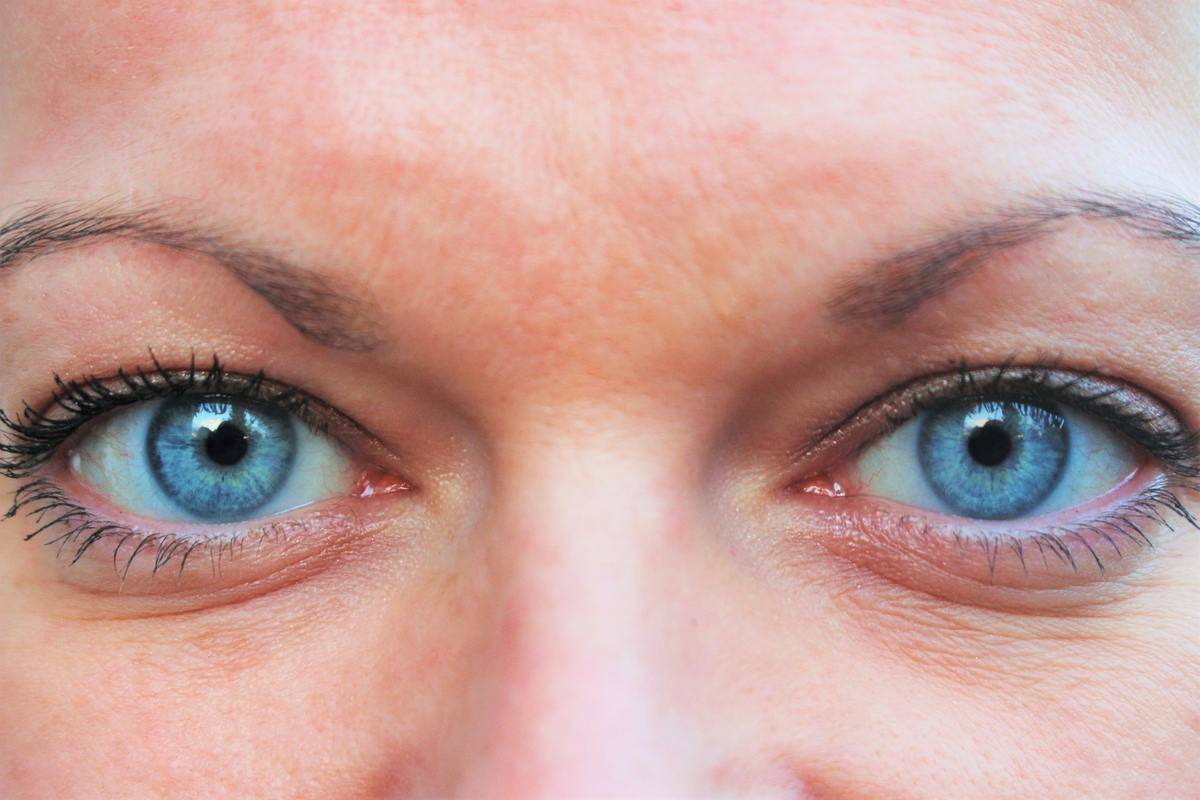 A closeup of someone's blue eyes.