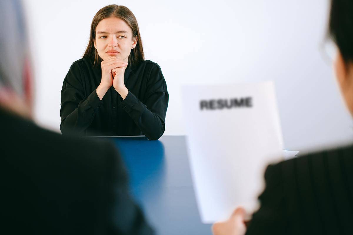 A woman at a job interview looking dissatisfied.