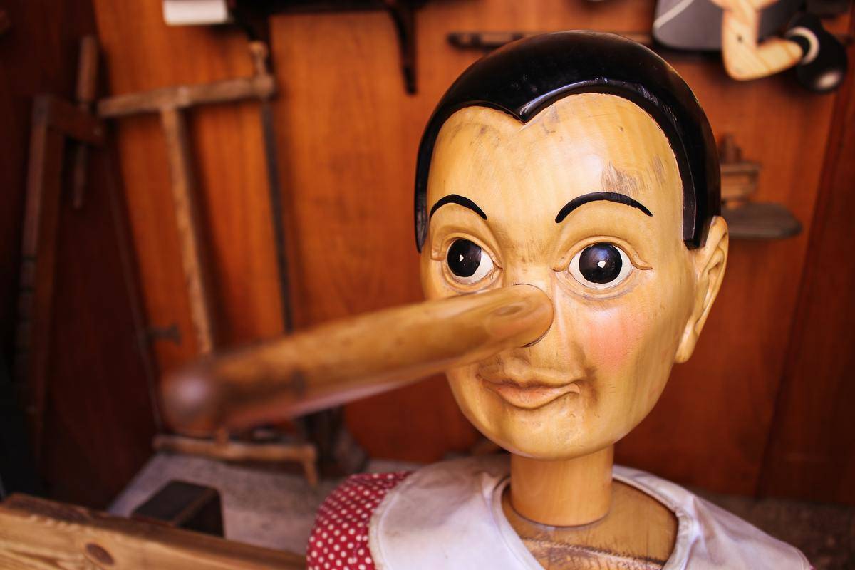 A wooden Pinocchio puppet with its elongated nose.