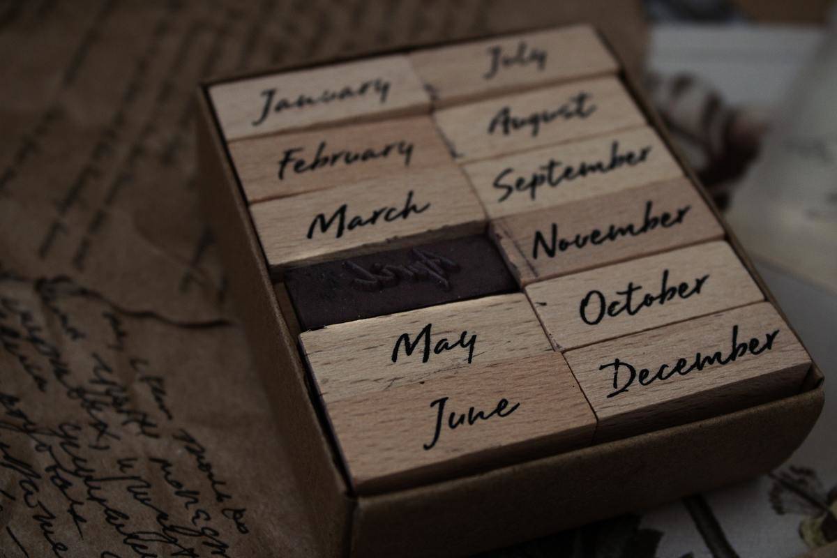 A set of stamps in a box, one for each month.