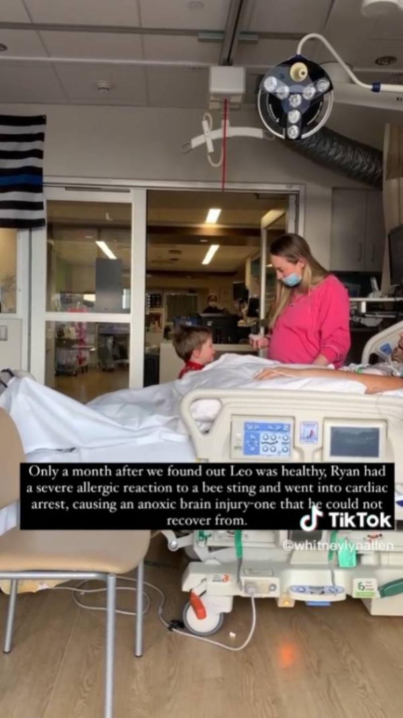 Whitney in the hospital with Ryan and their other son.