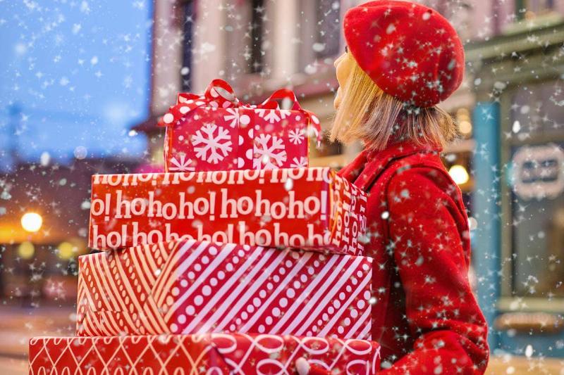 woman-holding-three-red-christmas-presents-boxes