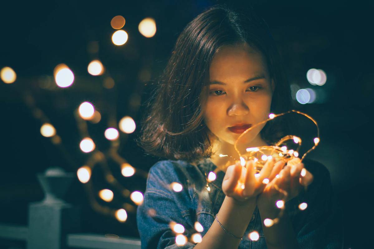close-up-photography-of-woman-holding-sting-lights-
