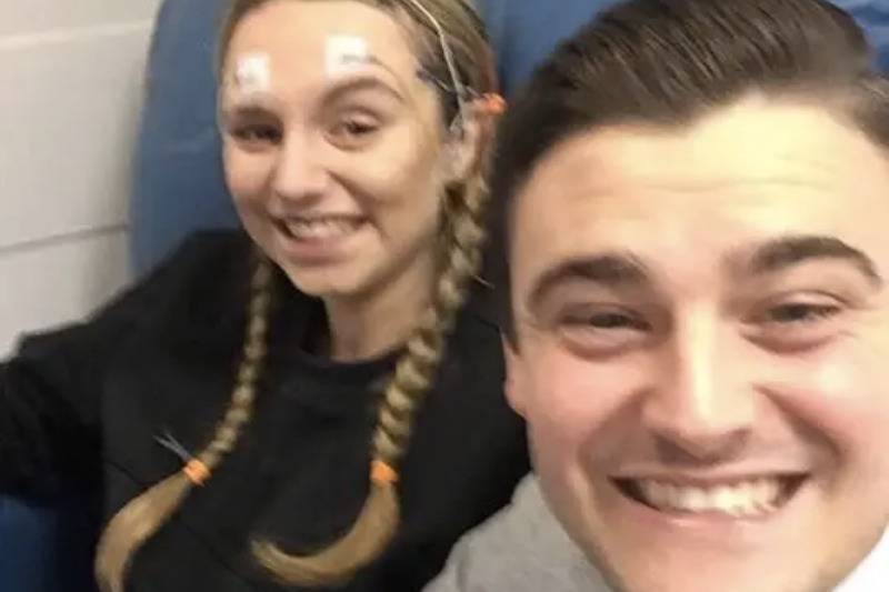 Jessica with head wires takes selfie with boyfriend