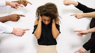 a-woman-covering-her-ears