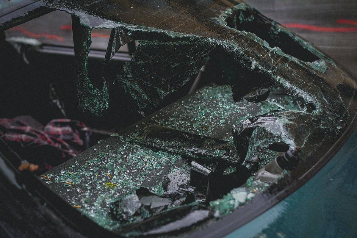The shattered back windshield of a car after an accident.