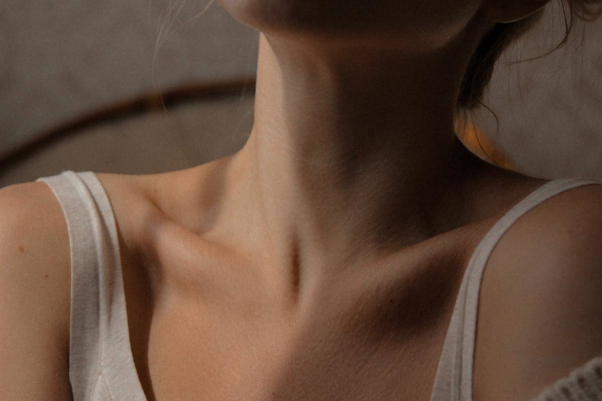 a closeup of a woman's neck and collarbones.