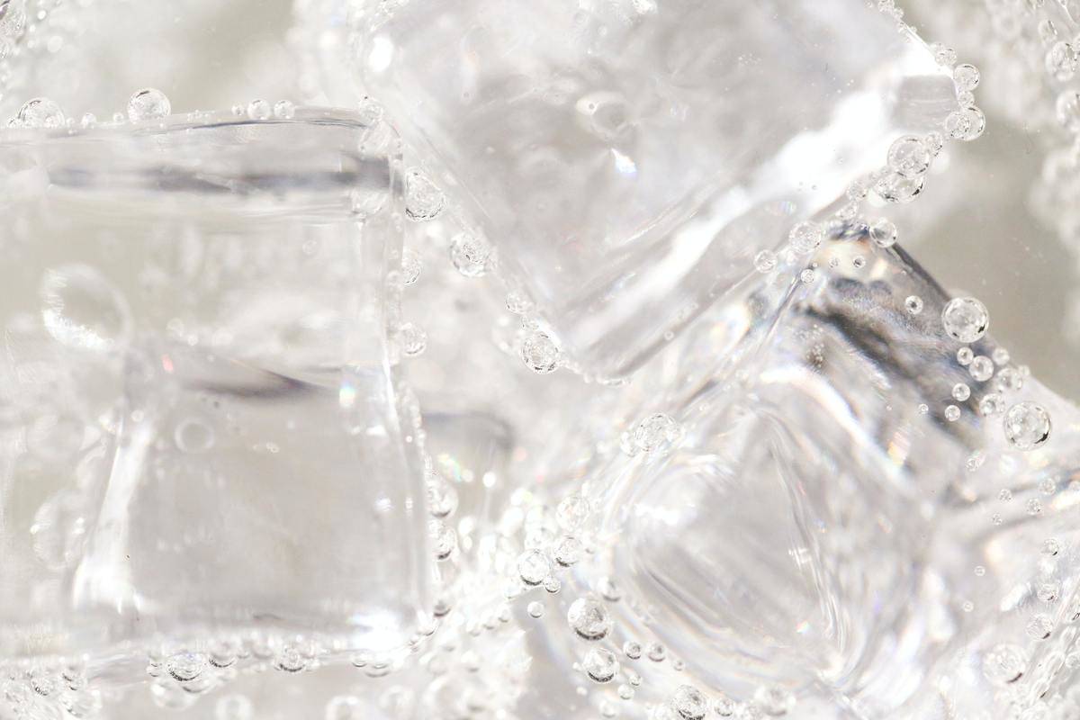 A closeup of ice cubes in water.