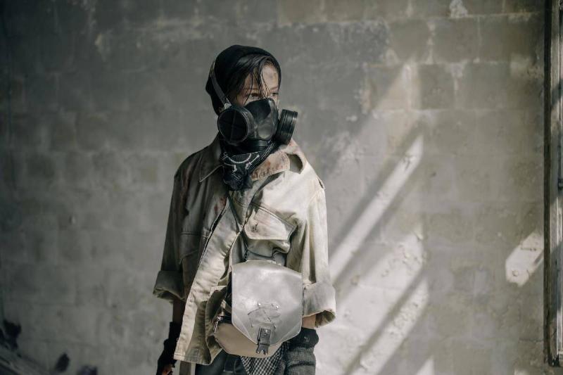 woman-in-brown-leather-jacket-wearing-black-gas-mask-4