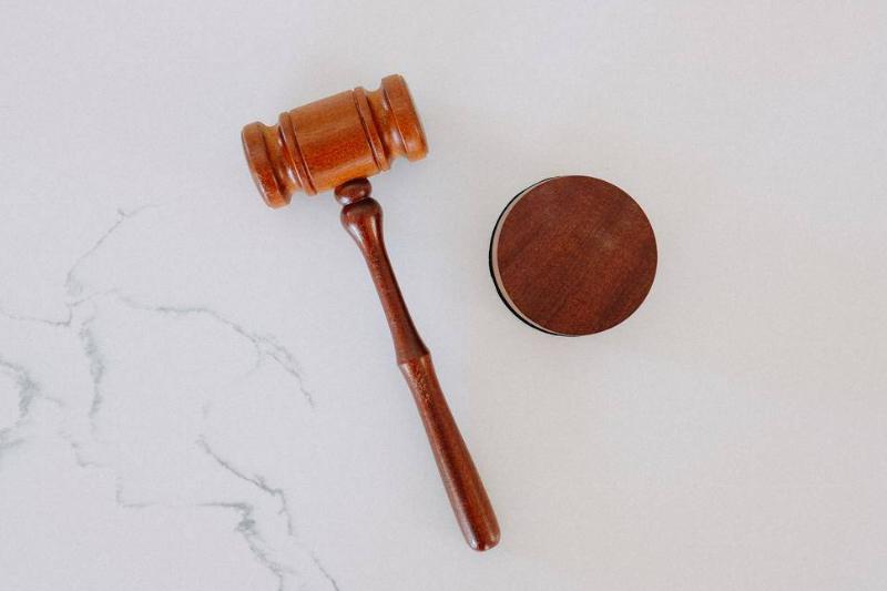 A gavel against a marble background.