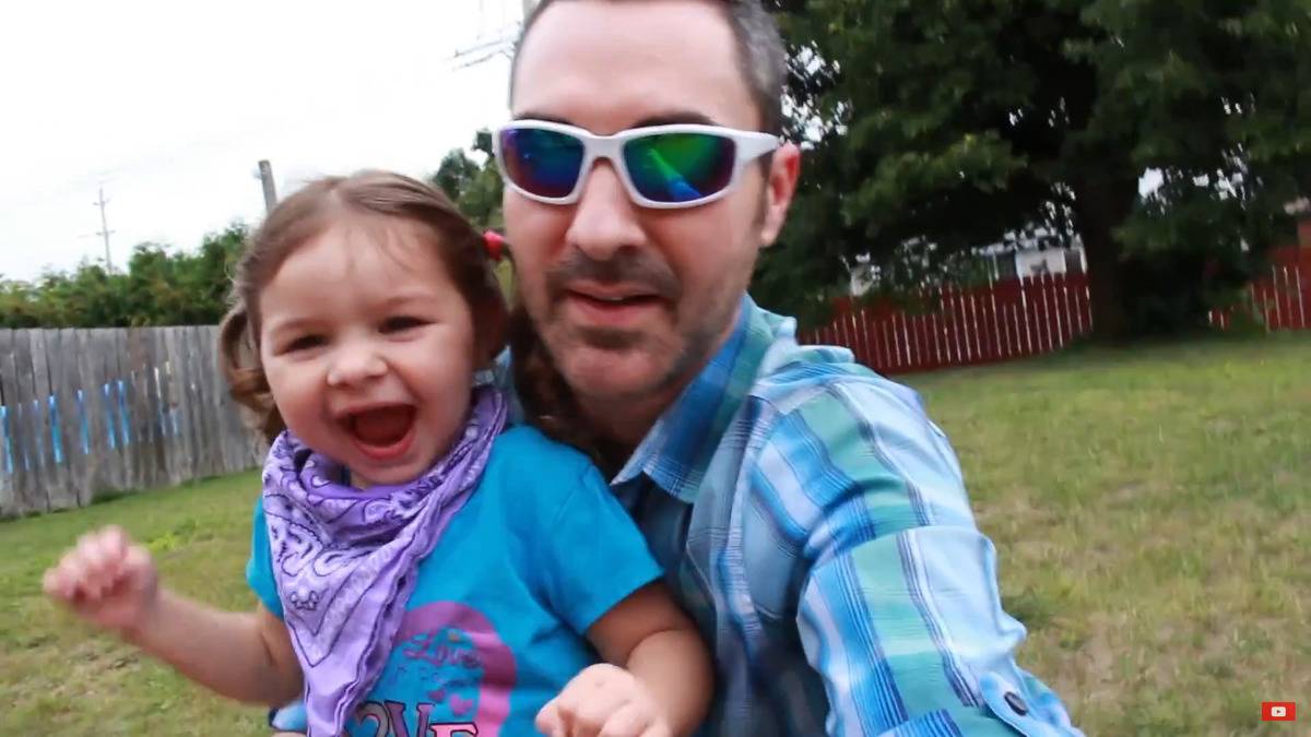 A screenshot of Ever and her dad from a video on her family's vlogging account.