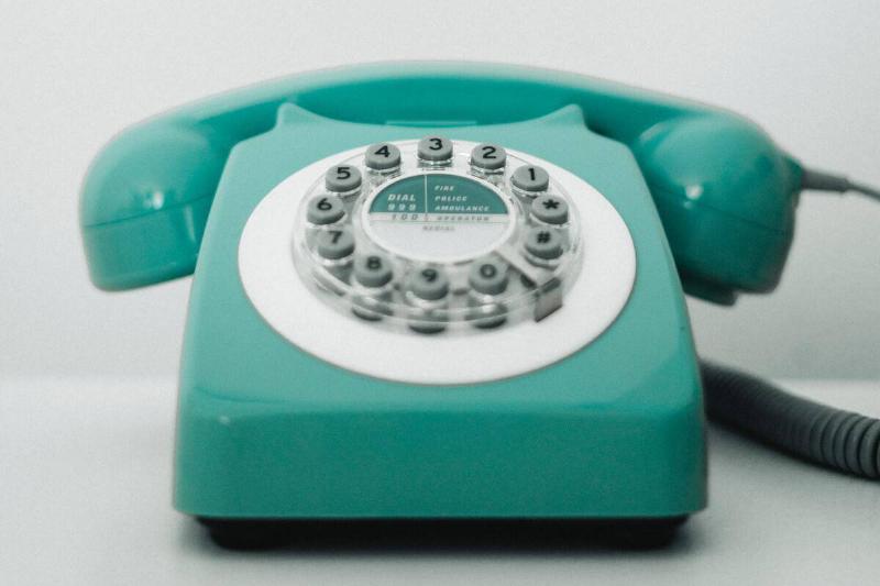 A teal rotary phone.