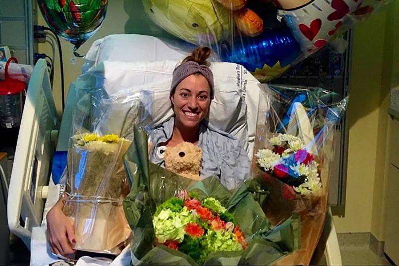 Brittany Williams when she was recovering in the hospital, surrounded by flowers and balloons. 