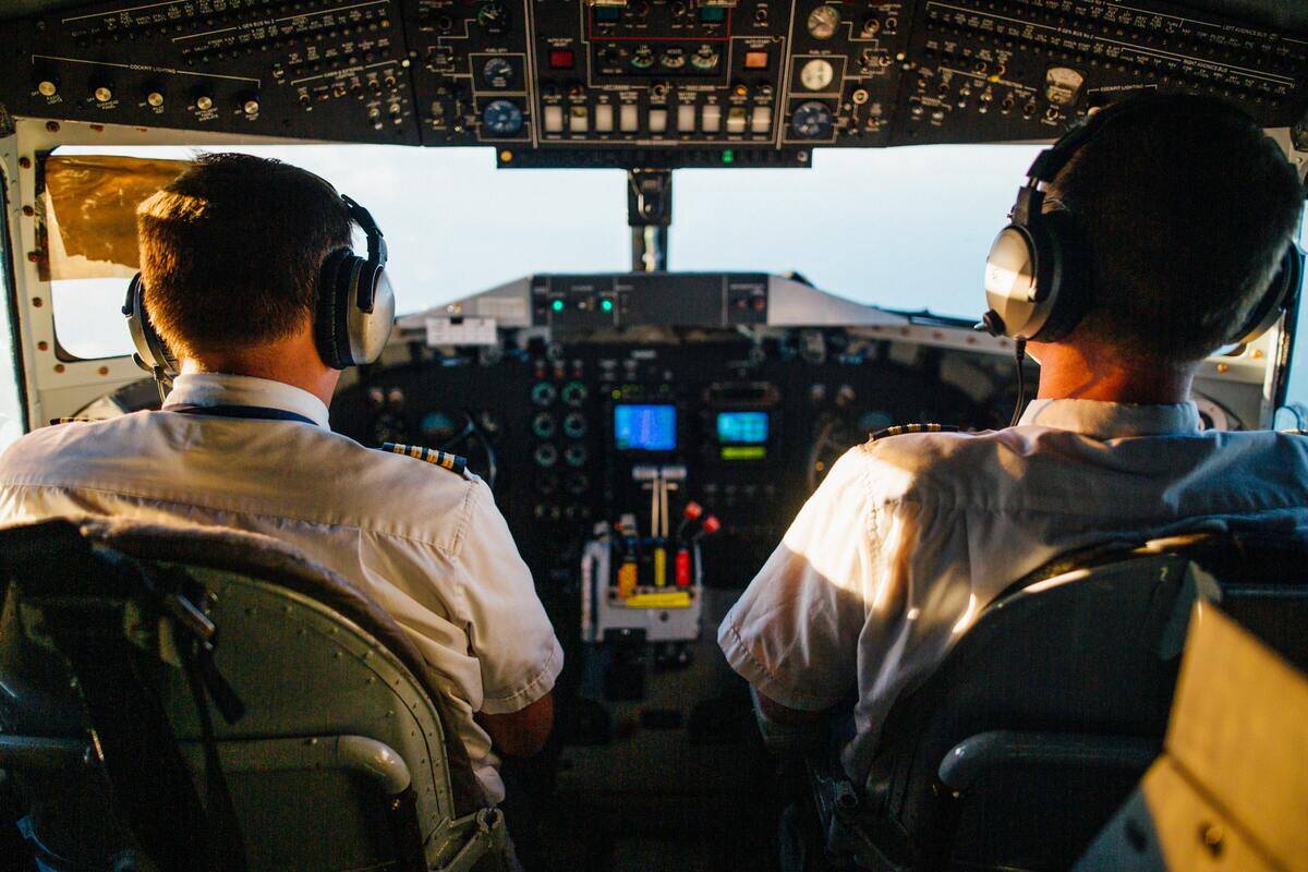 Two pilots in a plane's cockpit.