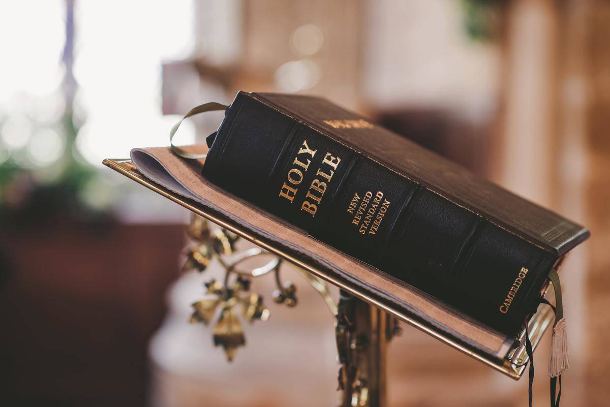 A large bible placed on a podium.