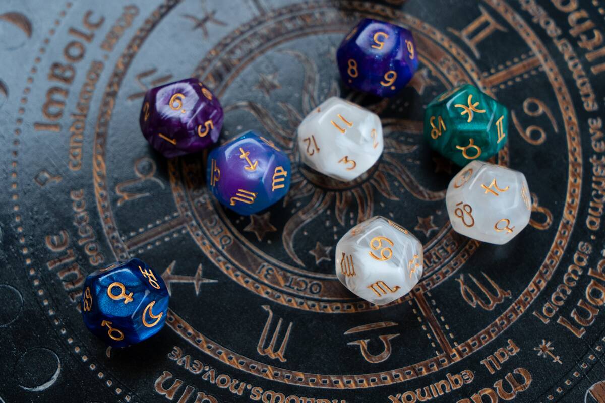 Horoscope zodiac circle with divination dice atop an astrological circle.