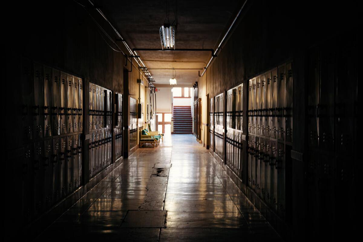 A dark school hallway.