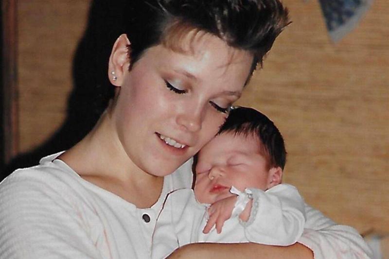 Rachel's mom holding her when she was newly born, before putting her up for adoption.