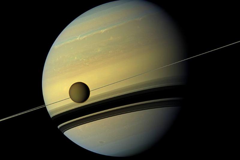 A photo of Saturn and one of its moons.