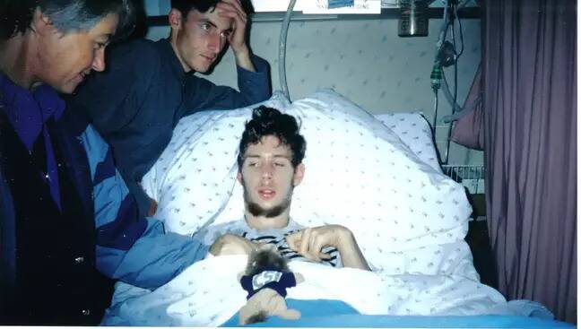 Martin laying in his hospital bed.