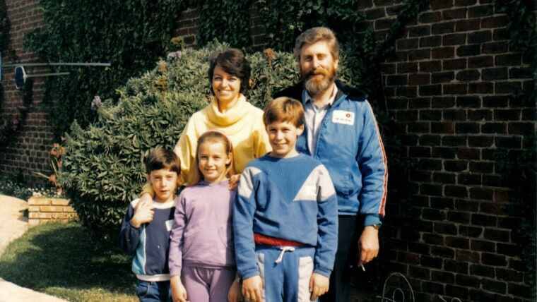 Martin before he became ill standing with his family.