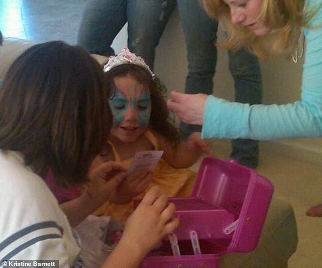 Natalia getting her face painted during a birthday party.