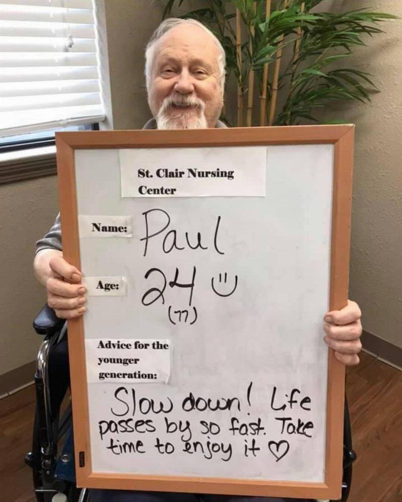 Paul holding his sign.