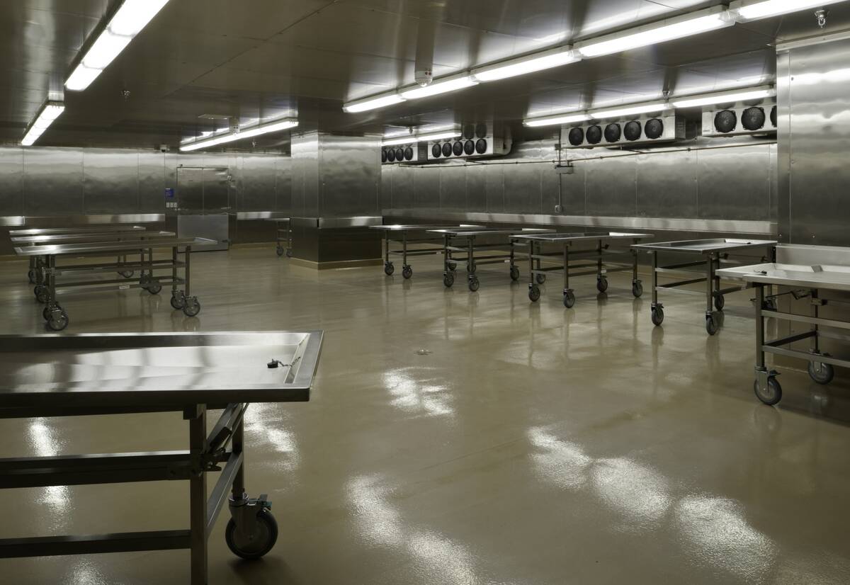 A bleak, grey interior of a morgue.