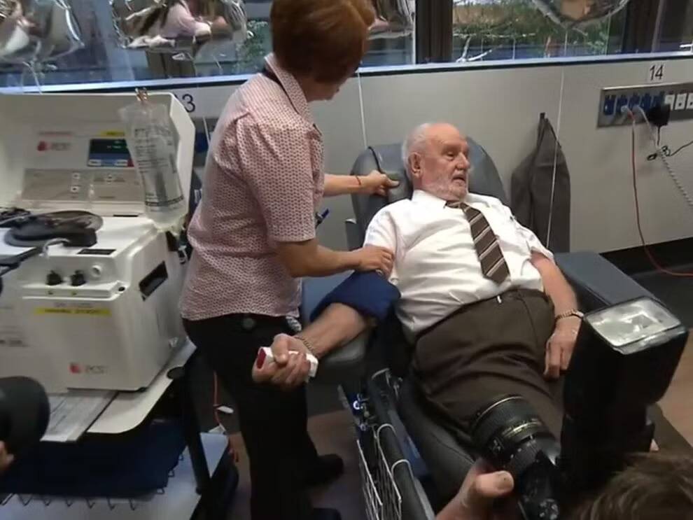 James in the clinic chair, preparing to give blood.