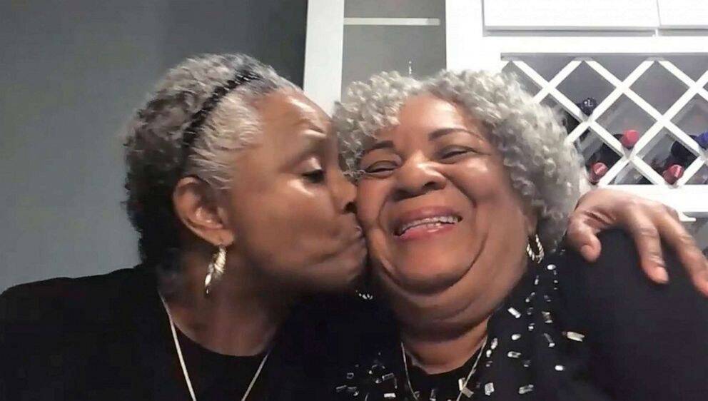 Geraldine and Lawrencia on a video call talking about their experience, Lawrencia kissing her mom on the cheek.