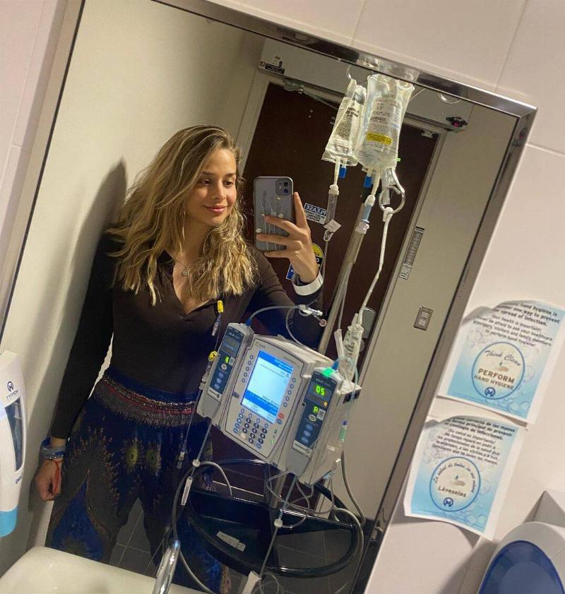Bailey taking a photo with her IV device.