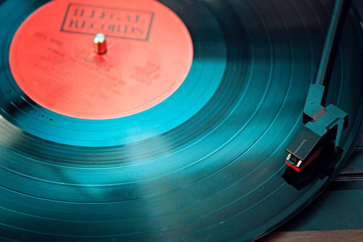 A vinyl record spinning on a turntable.